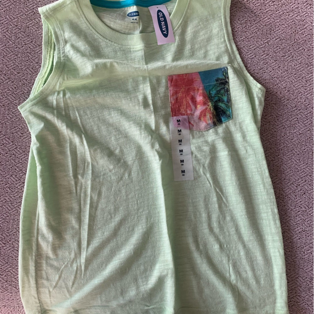 Brand new boys sleeve-less shirt.